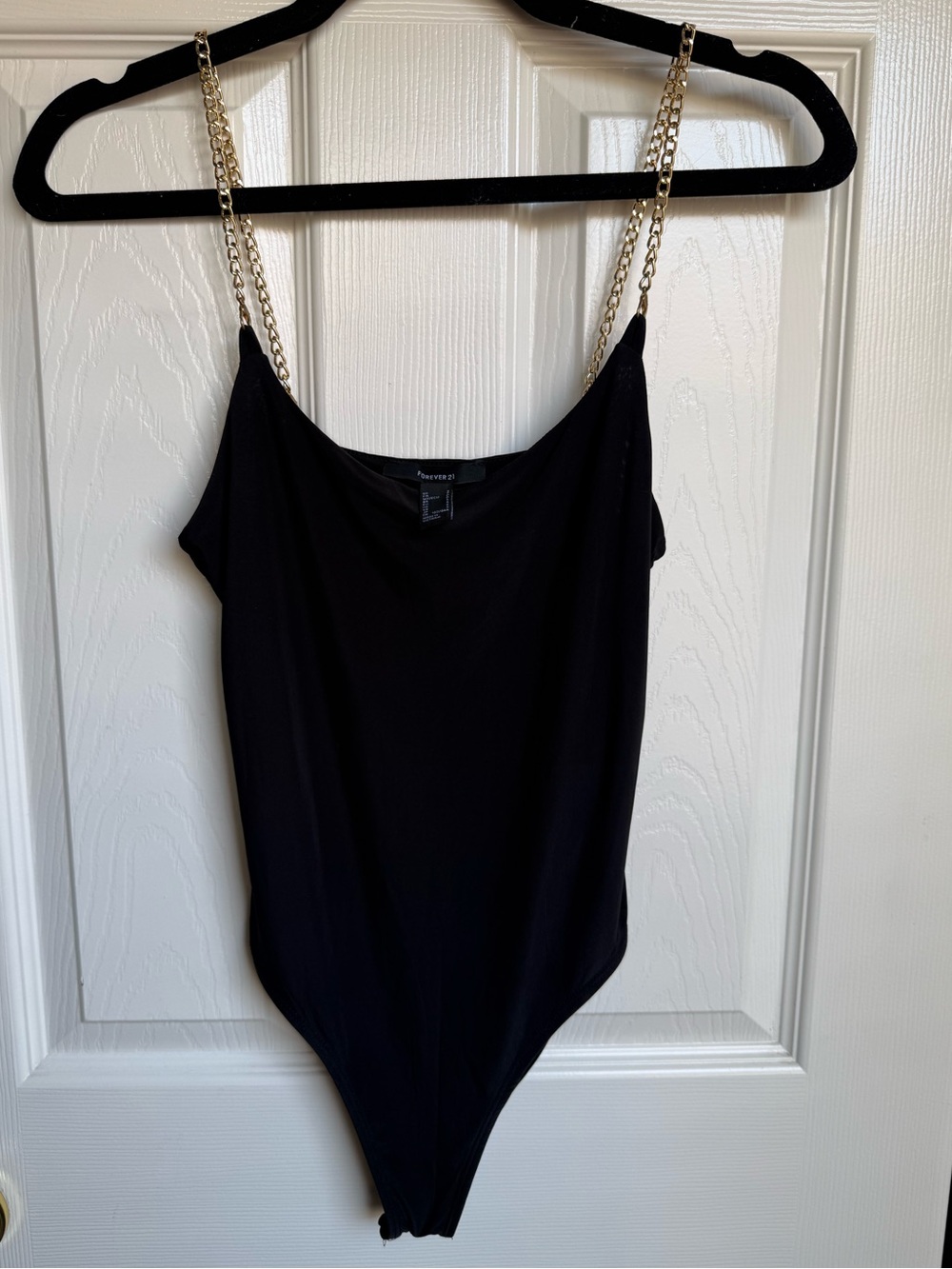 Forever 21 womanβs black body suit with gold chain straps